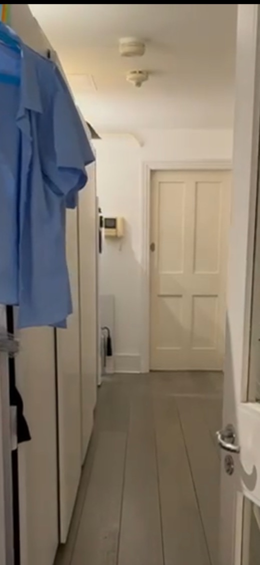 Before: the Hyde Park hallway with freestanding wardrobes along one wall, clothes hanging over the doors