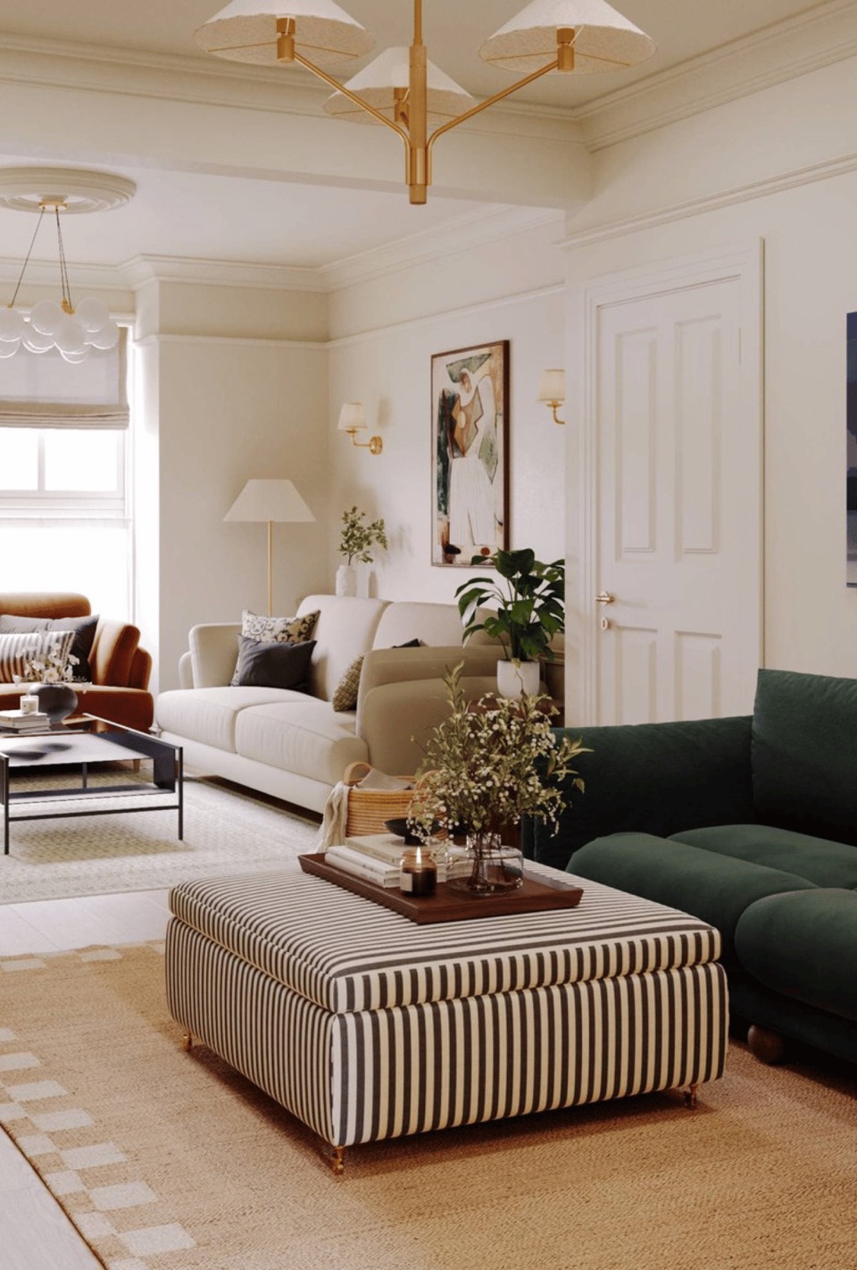 Sitting room organised and styled by Studio 14 in a London home, with natural light, a green velvet sofa and a striped ottoman